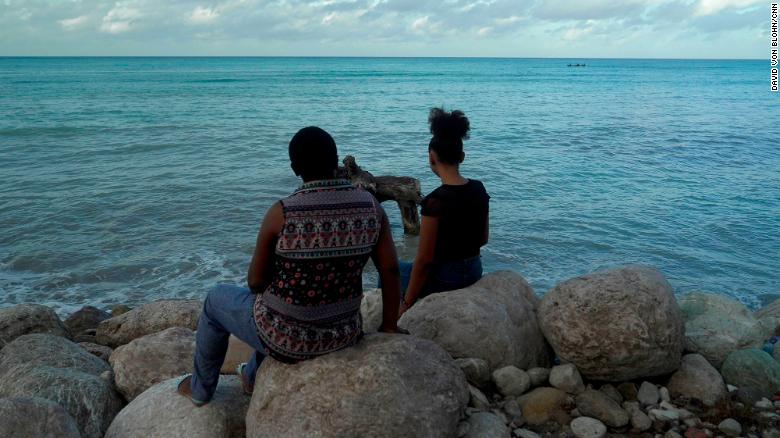 Roselaine, a victim, and her daughter in Port Salut, Haiti, requested partial anonymity due to stigma.
