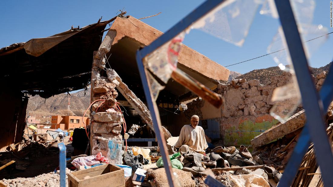 Ait Abdellah Brahim, 86, sits in rubble in Talat N&#39;Yaaqoub, Morocco, on Saturday, September 16.