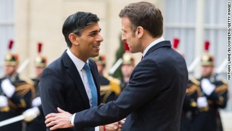 France&#39;s Emmanuel Macron greets UK Prime Minister Rishi Sunak ahead of their bilateral meeting at the Elysee Palace in Paris on March 10, 2023.