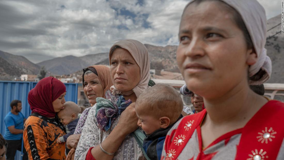 People wait to receive assistance in their village between the cities of Marrakech and Taroudant on Sunday, September 17.
