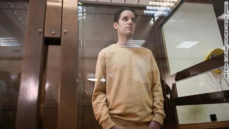 Evan Gershkovich stands inside a defendants&#39; cage before a hearing in Moscow on Tuesday.