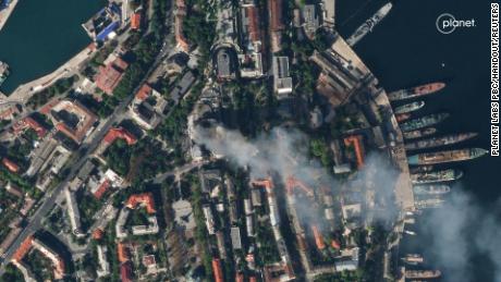 A satellite image shows smoke billowing from a Russian Black Sea Navy HQ after a missile strike in Sevastopol, Crimea, on September 22.
