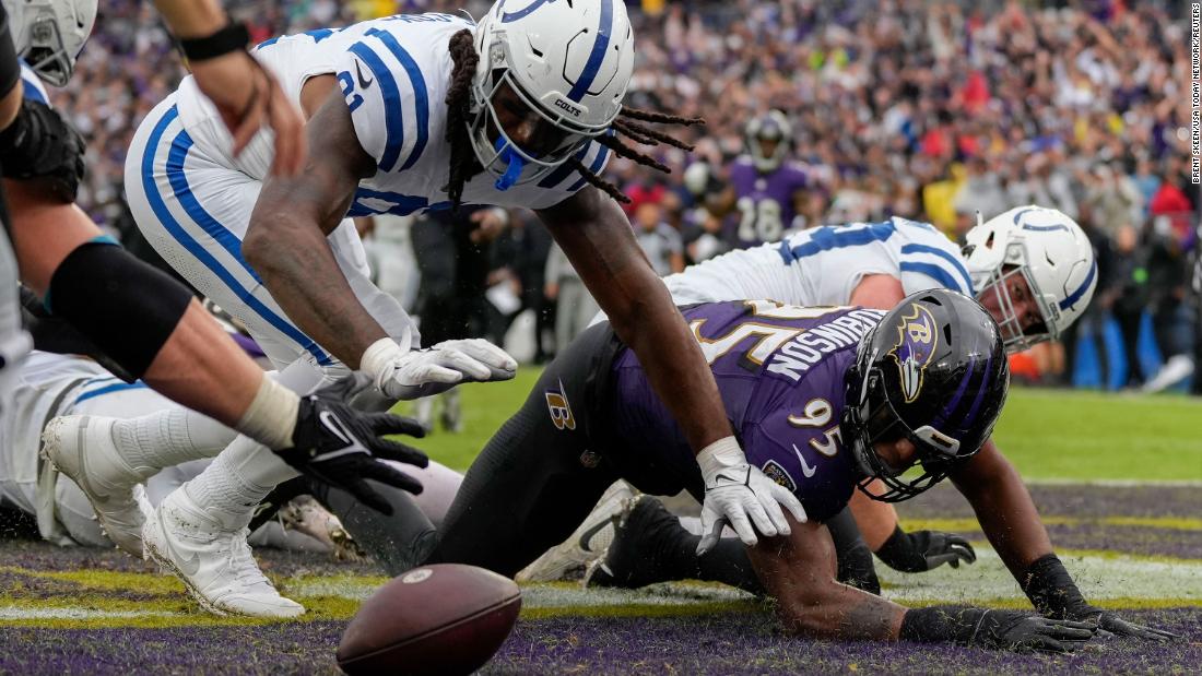 Indianapolis Colts tight end Mo Alie-Cox and Baltimore Ravens linebacker Tavius Robinson go after a fumble in the end zone on September 24. The Colts beat the Ravens 22-19.