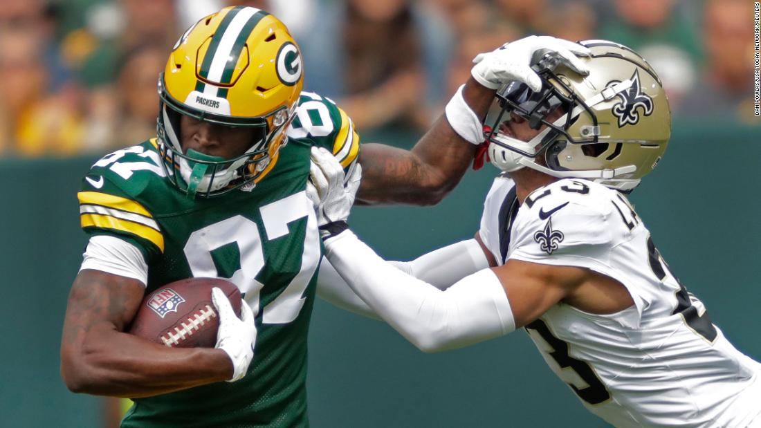 Green Bay Packers wide receiver Romeo Doubs fends off New Orleans Saints cornerback Isaac Yiadom during the first half at Lambeau Field on September 24. The Packers edged out a 18-17 win. 