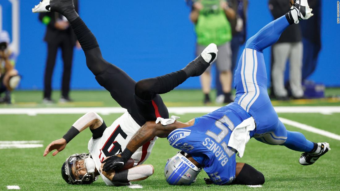 Atlanta Falcons quarterback Desmond Ridder is sacked by Detroit Lions linebacker Derrick Barnes in the first half at Ford Field in Detroit on September 24. The Falcons lost 20-6.