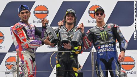 First-placed Bezzecchi (C), second-placed Prima Pramac Racing&#39;s Spanish rider Jorge Martin (L) and third-placed Monster Energy Yamaha&#39;s French rider Fabio Quartararo pose on the podium after the Indian MotoGP Grand Prix.
