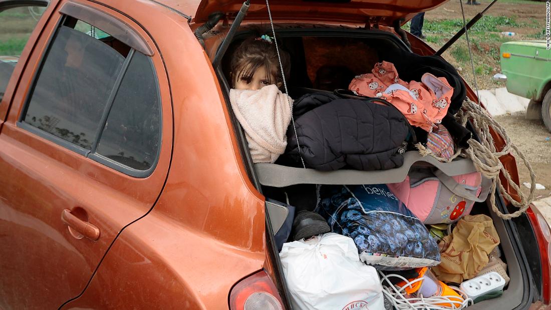 A girl from Nagorno-Karabakh looks out from a car while traveling to Armenia on September 26.