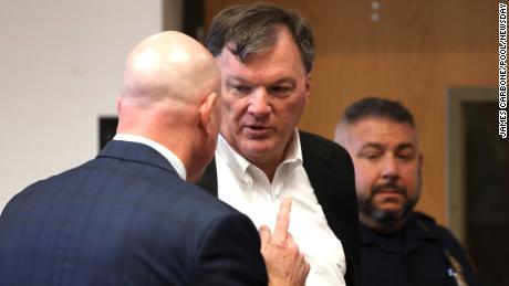 Rex Heuermann appears with his lawyer Michael Brown, left, at Suffolk County Court in Riverhead, New York, on Wednesday.