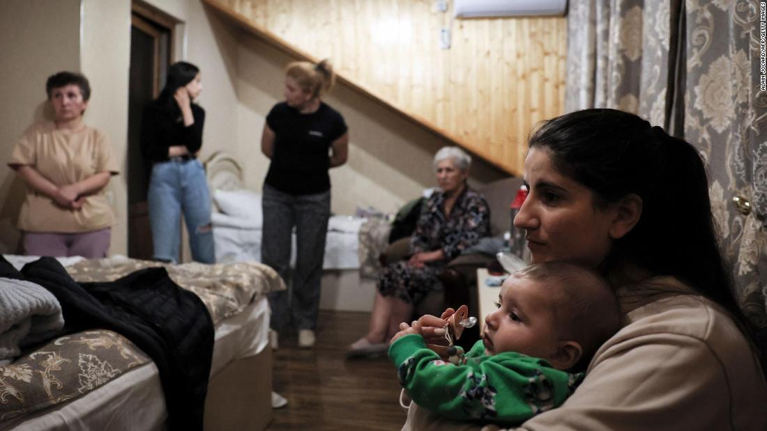 Former Nagorno-Karabakh residents at a hotel room in Goris after crossing the Armenian border on September 26.