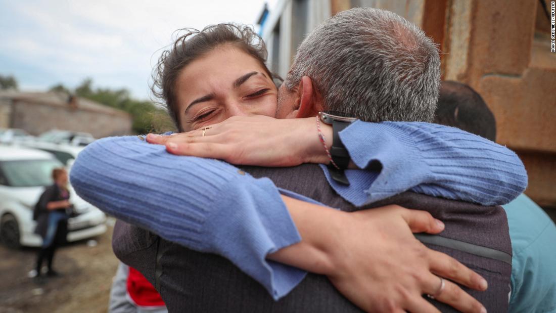 Karine Djagaryan, who fled Nagorno-Karabakh, hugs her father, Novlet, as they meet in Kornidzor on September 26.
