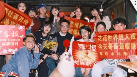 Liang (center) and his friends threw a resignation party in May after quitting their jobs.
