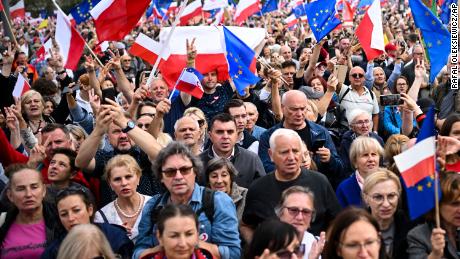 People waved Polish and EU flags at Sunday&#39;s rally.
