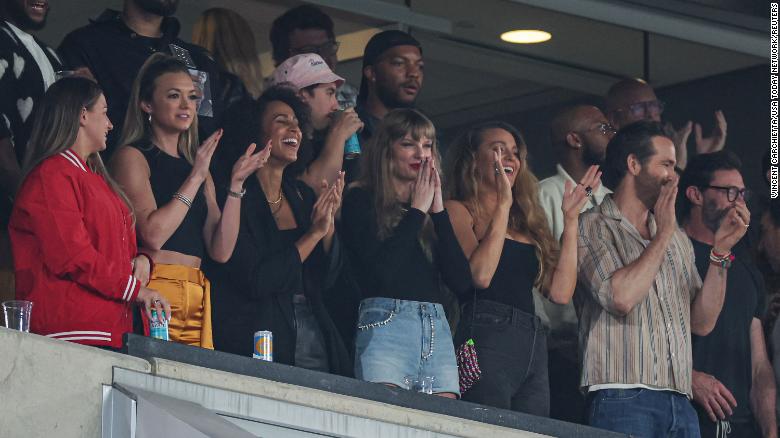 New photos show Taylor Swift cheering on Travis Kelce