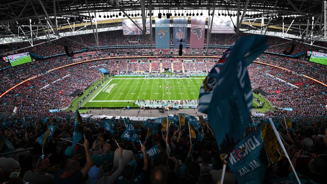 Jacksonville Jaguars fans wave flags ahead of a game against the Atlanta Falcons at Wembley Stadium in London on October 1. It was the first of five international games the NFL has scheduled this season as part of its ever-expanding International Series. The Jaguars won 23-7.