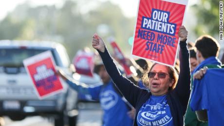 75,000 Kaiser Permanente workers walk off the job. It&#39;s the largest health care worker strike in US history