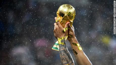 TOPSHOT - France's defender Djibril Sidibe raises their World Cup trophy during the trophy ceremony at the end of the Russia 2018 World Cup final football match between France and Croatia at the Luzhniki Stadium in Moscow on July 15, 2018. (Photo by FRANCK FIFE / AFP) / RESTRICTED TO EDITORIAL USE - NO MOBILE PUSH ALERTS/DOWNLOADS        (Photo credit should read FRANCK FIFE/AFP via Getty Images)