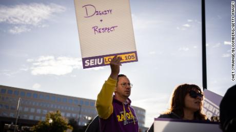 Kaiser Permanente healthcare workers and supporters on a picket line outside Kaiser Permanente medical offices in Denver.