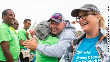Garth Brooks and Trisha Yearwood meet volunteers and future homeowners at the  Habitat for Humanity International&#39;s Jimmy &amp; Rosalynn Carter Work Project in Edmonton, Canada in 2017.
