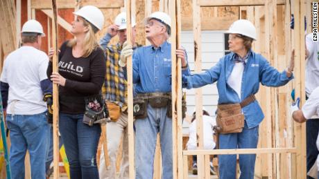Trisha Yearwood helps the Carters raise the walls of a new Habitat home in Memphis Tennessee in 2015. 