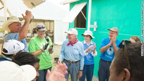The Carters along with Garth Brooks and Trisha Yearwood dedicate the houses they helped build in Haiti in 2012.