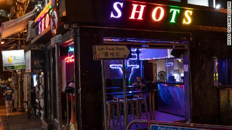 A man sits inside a bar in Lan Kwai Fong, Hong Kong&#39;s renowned nightlife hub.