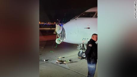 Damage to the nose of an aircraft is seen Friday night after the plane collided with a shuttle bus as the craft was taxiing at Chicago O&#39;Hare International Airport.