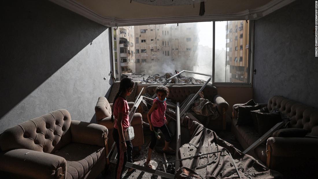 Children are seen in a damaged house in Gaza after Israeli airstrikes on October 7.