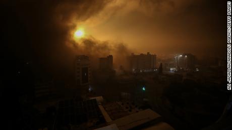 Flames rise in Burc Vatan shopping mall in Gaza following bombing of Israeli forces with warplanes. 