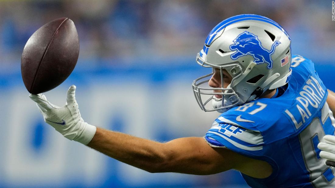 Detroit Lions tight end Sam LaPorta tries in vain to pull in a pass reception in Detroit on Sunday, October 8. The Lions beat the Carolina Panthers 42-24.