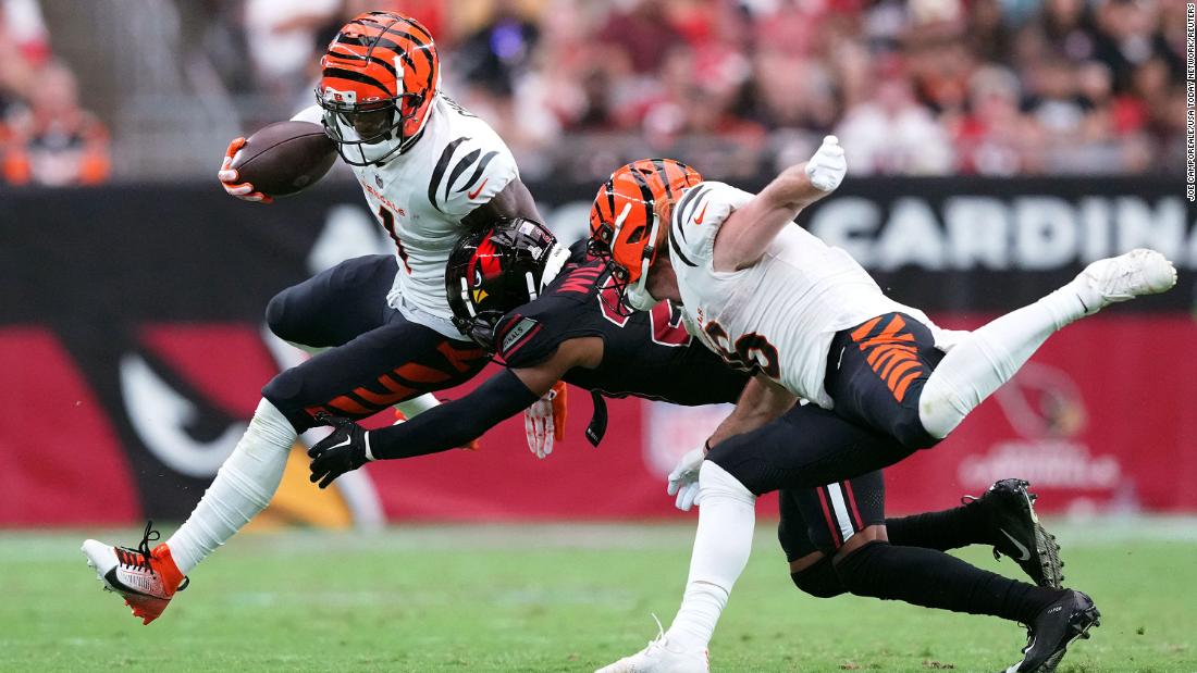 Cincinnati Bengals wide receiver Ja&#39;Marr Chase runs past Arizona Cardinals cornerback Marco Wilson after making a catch during the Bengals&#39; 34-20 victory over the Cardinals on October 8. Chase scored three touchdowns during the game.