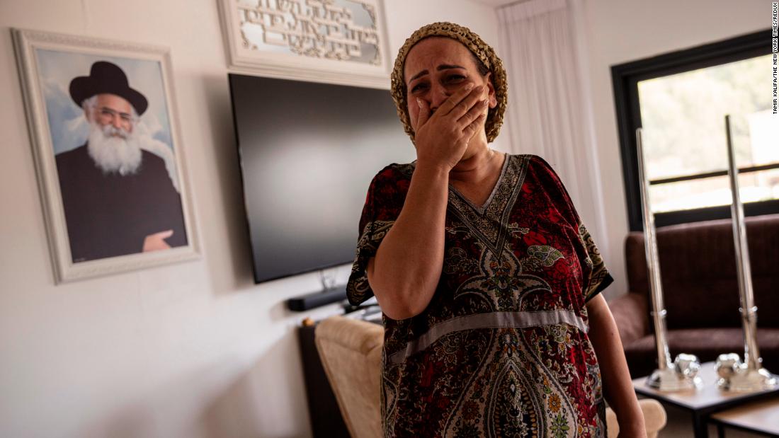 Tali Touito reacts as she describes how Hamas gunmen attacked and took over the police station on her street, in Sderot, Israel, on Sunday, October 8.
