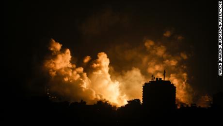 Smoke rises over buildings in Gaza City on October 9, during an Israeli air strike.
