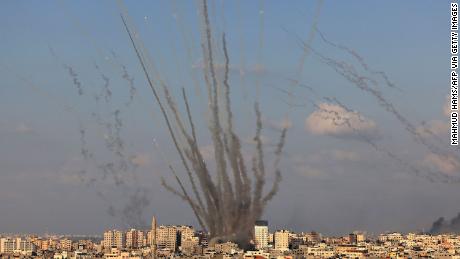 Israel bolsters troops at border with Gaza as Hamas hits Ashkelon with rocket barrage
