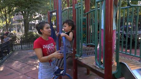Diana Amezquita, from Bogota, Colombia, plays with her children at a playground on Manhattan&#39;s west side.
