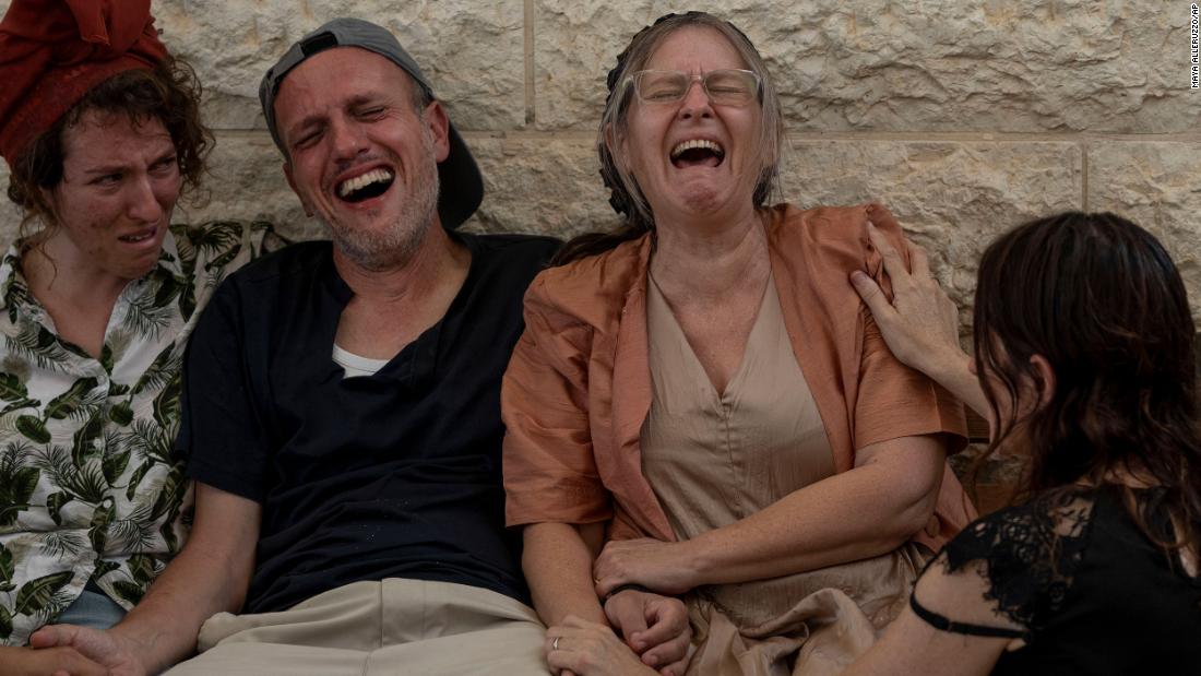Itzik and Miriam Shafir, center, mourn during their son&#39;s funeral at a cemetery in Modiin Maccabim, Israel, on October 11. Their son, Dor Shafir, and his girlfriend, Savion Kiper, were killed during &lt;a href=&quot;https://www.cnn.com/2023/10/07/middleeast/israel-gaza-fighting-hamas-attack-music-festival-intl-hnk/index.html&quot; target=&quot;_blank&quot;&gt;Hamas&#39; attack on a music festival&lt;/a&gt; on Saturday.