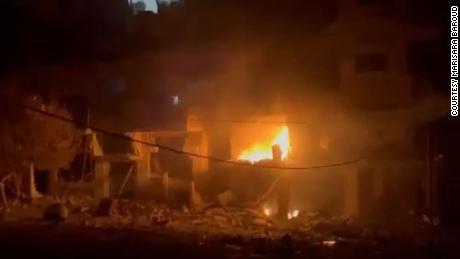 Maisara Baroud&#39;s building on fire following an Israeli airstrike.