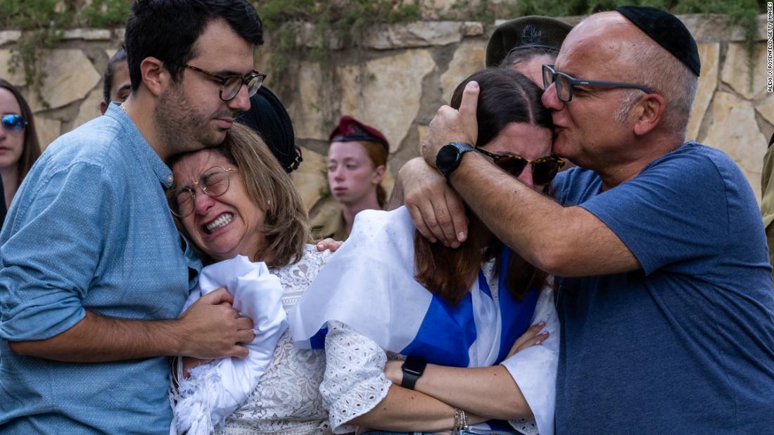 Family members of Valentin Ghnassia react during his funeral ceremony at the Mount Herzl Military Cemetery in Jerusalem on October 12. Ghnassia was killed in a battle with Hamas militants in Be&#39;eri, Israel.