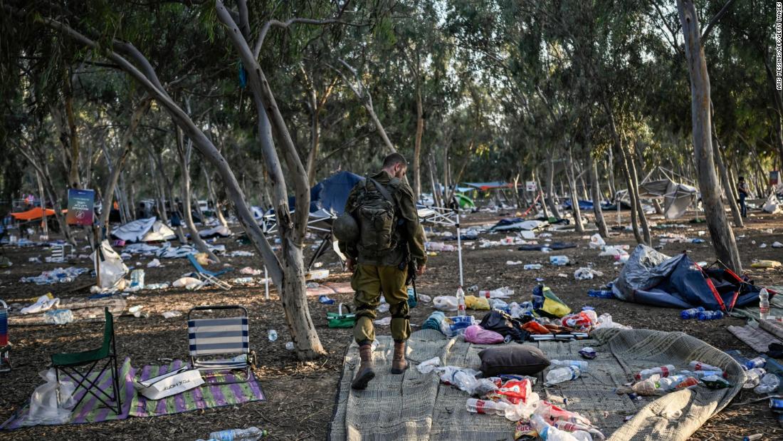 An Israeli soldier patrols near the Nova music festival grounds near Be&#39;eri, Israel, on October 12.
