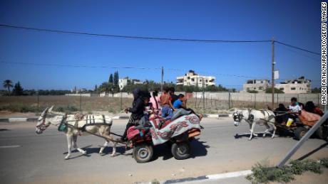 Palestinians flee in Gaza City, on Friday, after Israel called for the immediate relocation of 1.1 million people along the strip.