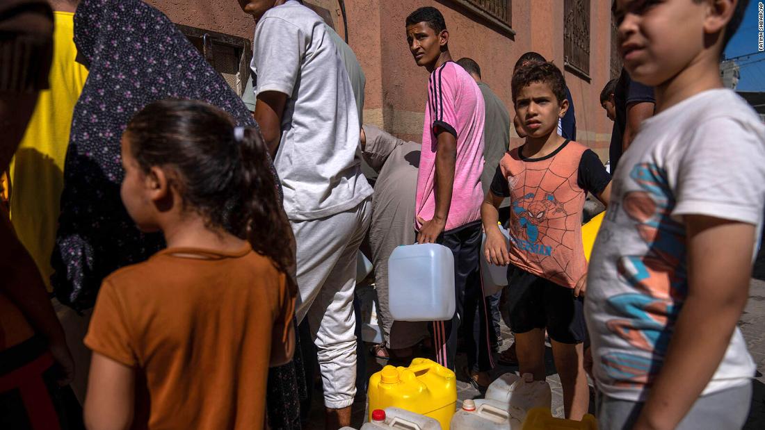 Palestinians collect water from a tap on October 15 after &lt;a href=&quot;https://www.cnn.com/2023/10/10/middleeast/gaza-complete-siege-israel-intl/index.html&quot; target=&quot;_blank&quot;&gt;Israel blocked supplies&lt;/a&gt; of electricity, food, water and fuel to Gaza.