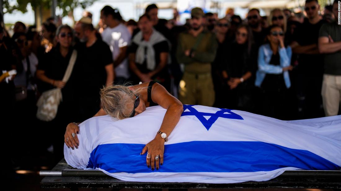 Antonio Macías&#39; mother cries over her son&#39;s body at Pardes Haim cemetery in Kfar Saba, Israel, on October 15. Macías was killed by Hamas at an &lt;a href=&quot;https://www.cnn.com/2023/10/07/middleeast/israel-gaza-fighting-hamas-attack-music-festival-intl-hnk/index.html&quot; target=&quot;_blank&quot;&gt;Israeli music festival&lt;/a&gt; earlier this month.