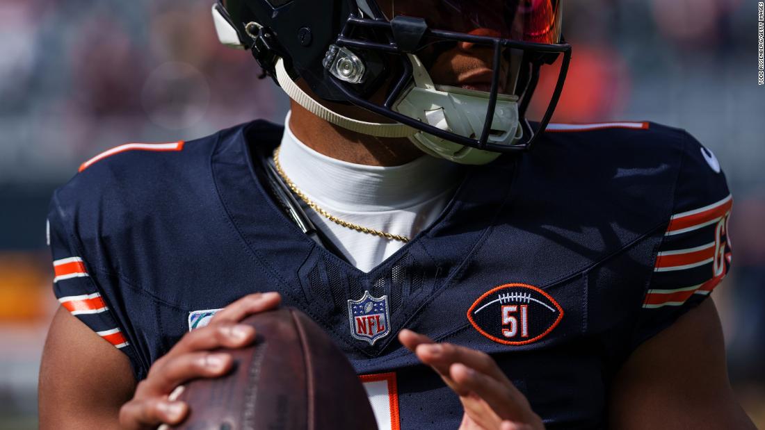 Chicago Bears quarterback Justin Fields warms up wearing a #51 patch honoring the late &lt;a href=&quot;https://www.cnn.com/2023/10/05/sport/dick-butkus-death-illinois-bears/index.html&quot; target=&quot;_blank&quot;&gt;Dick Butkus&lt;/a&gt; before the Bears&#39; game against the Minnesota Vikings at Soldier Field in Chicago on October 15. Butkus, a hard-hitting Pro Football Hall of Fame linebacker who played nine seasons for the Bears, died October 5. 