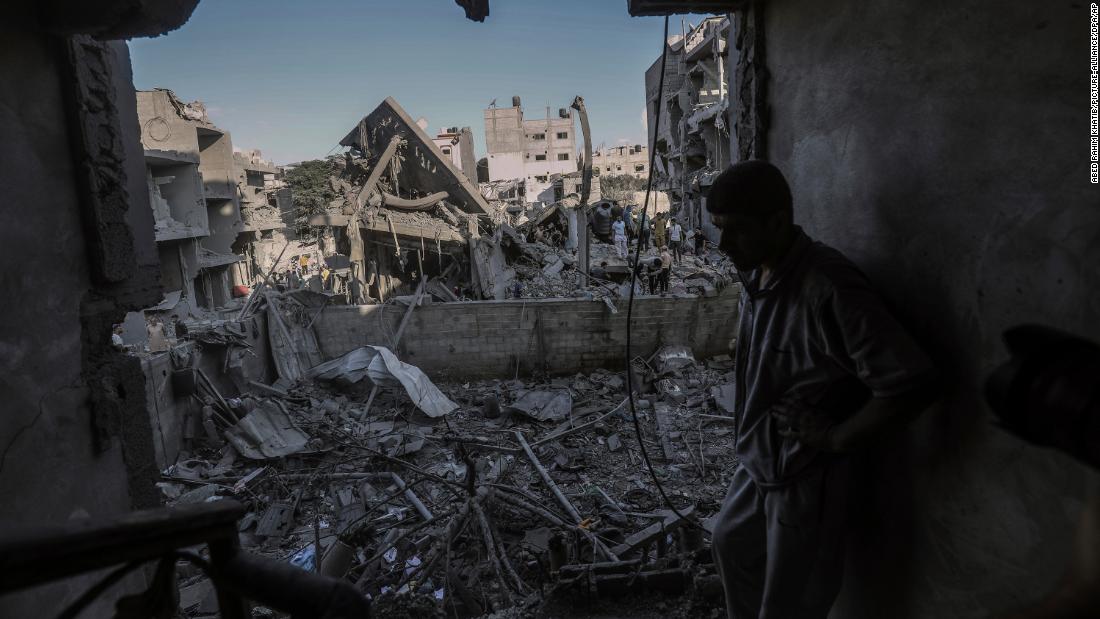 A Palestinian man inspects a destroyed house belonging to the Al-Jazzar family after an airstrike in Rafah, Gaza, on October 18.