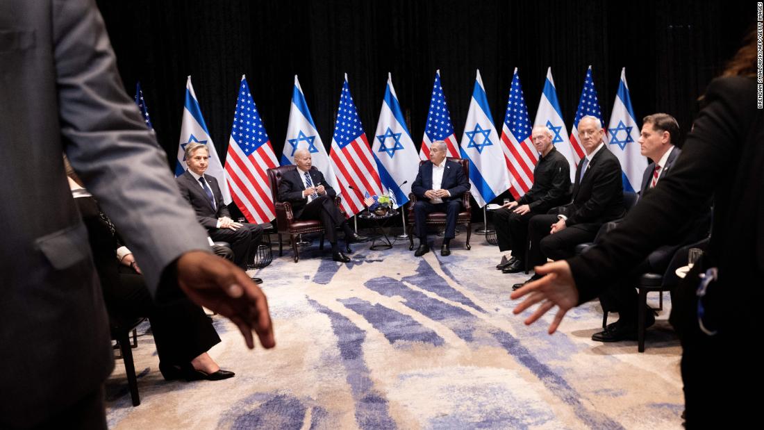 From left, US Secretary of State Antony Blinken and US President Joe Biden join Israel&#39;s Prime Minister Benjamin Netanyahu and other Israeli officials as they wait for the start of the Israeli war cabinet meeting in Tel Aviv on October 18.