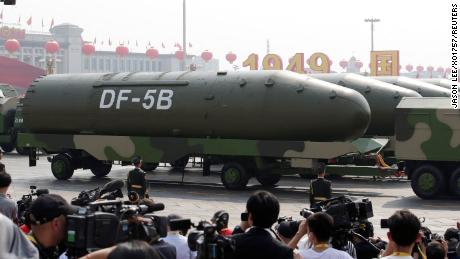 In this 2019 photo, military vehicles carrying DF-5B intercontinental ballistic missiles travel past Tiananmen Square during the military parade marking the 70th founding anniversary of People&#39;s Republic of China, on its National Day in Beijing.