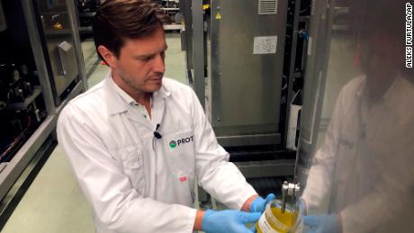 Kees Aarts, CEO of Dutch insect farming company Protix, pours oil made from black soldier fly larvae at the company&#39;s facility in the Netherlands. 