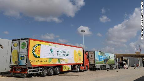 Aid convoy trucks wait at the Rafah Crossing for clearance to enter Gaza on October 19, 2023 in North Sinai, Egypt. 