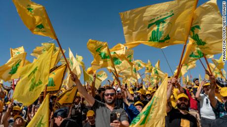 People with Hezbollah flags at a rally in Baalbek in Lebanon&#39;s Bekaa Valley in May 2022.