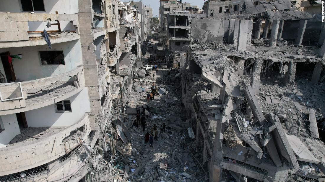 Palestinians look for survivors after an Israeli airstrike in Deir al-Balah, Gaza, on October 22.