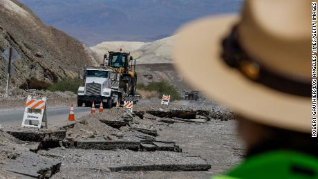 Road crews traverse along hwy 190 in Death Valley, California, on August 31, 2023, where most of the road was washed out. 